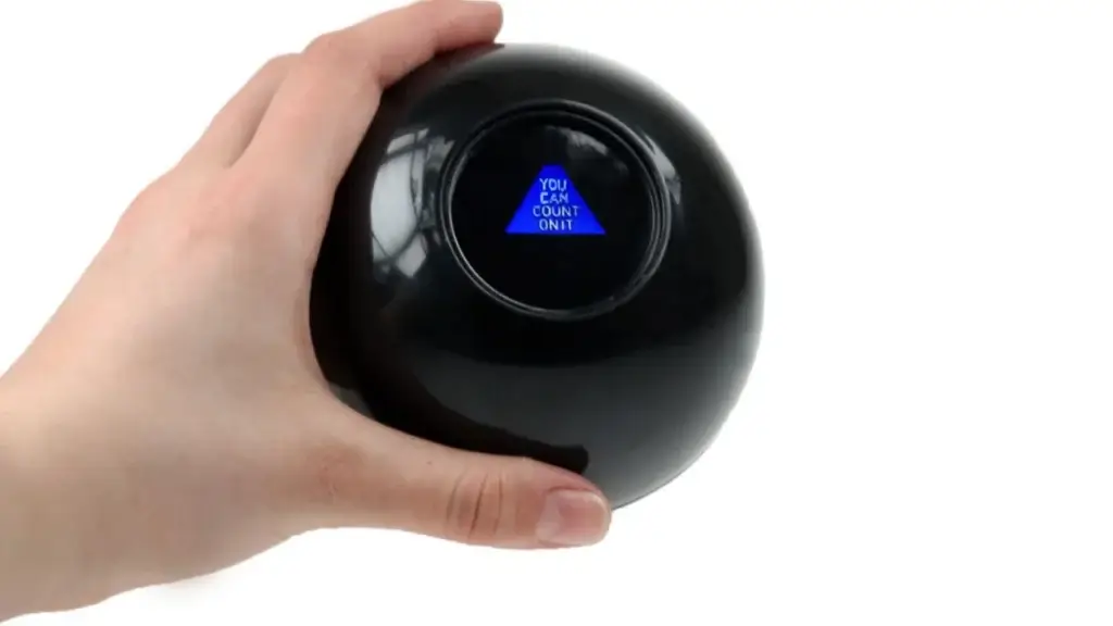 showing Magic 8 ball in one hand with the answer you can count it on